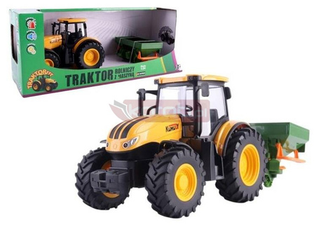 Traktor rolniczy z rozsiewaczem