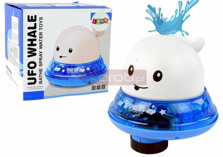 Wieloryb tryskający wodą biały